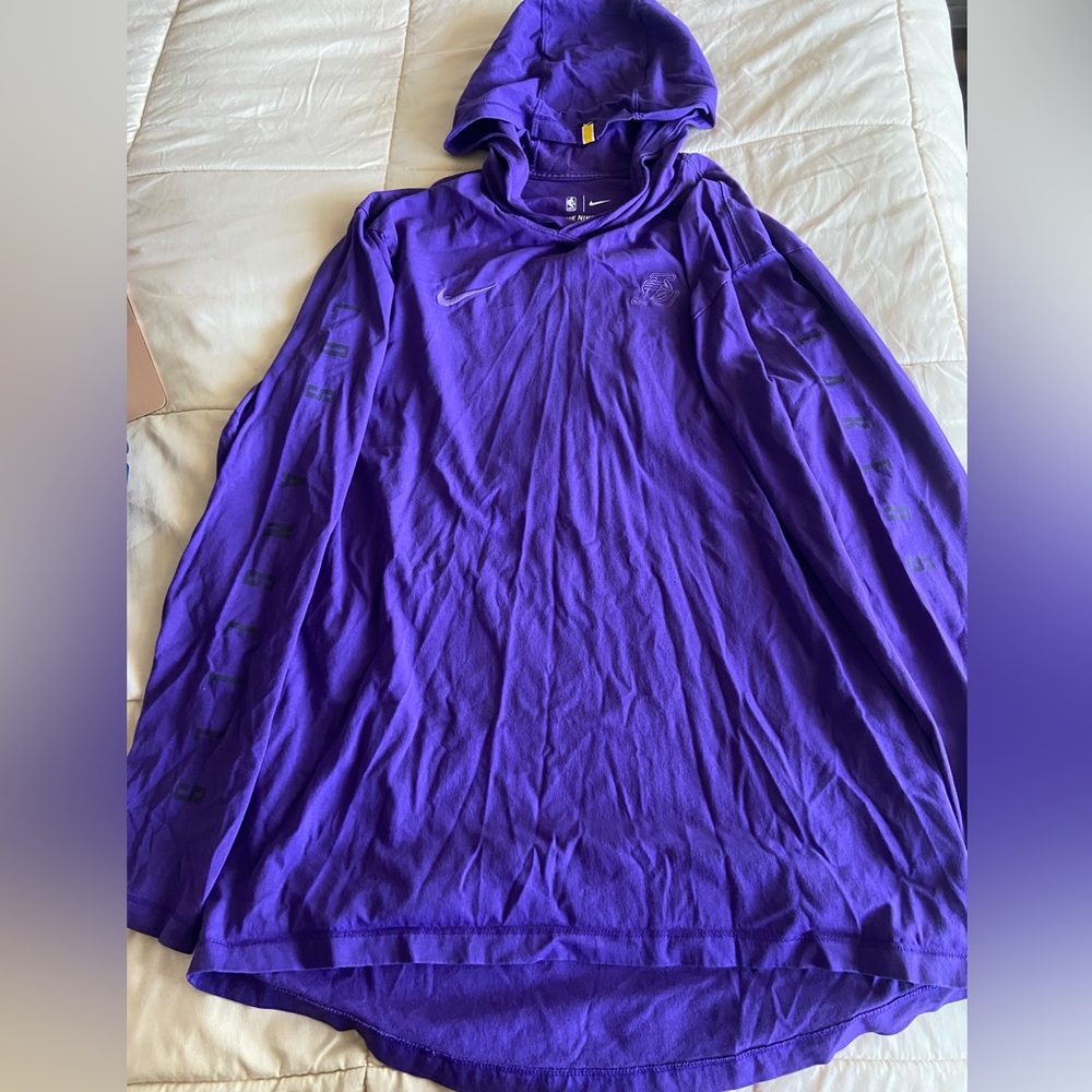 Purple, long sleeve shirt with hood. Lakers gear.